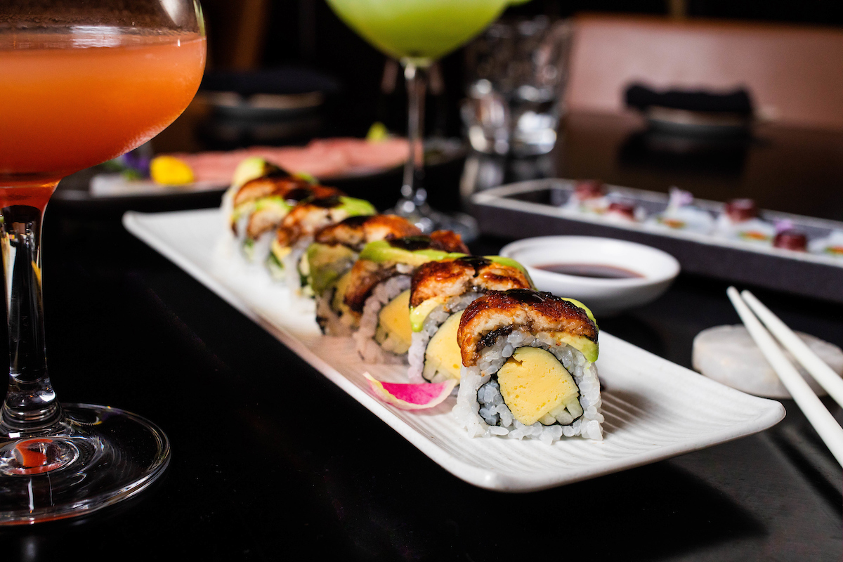 sushi roll on white plate on table